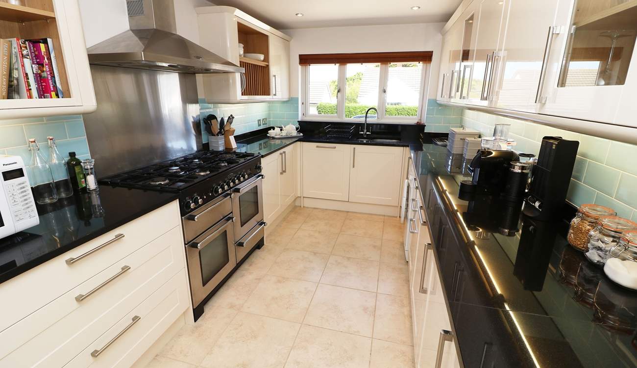 The impressive kitchen has all the equipment you will need. 