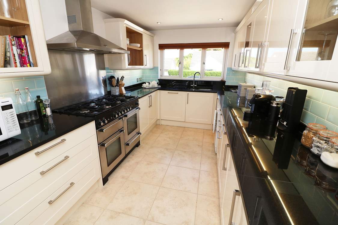 The impressive kitchen has all the equipment you will need.