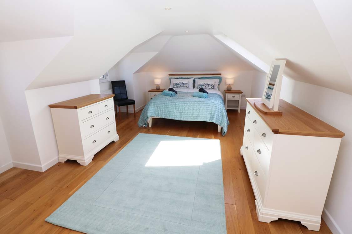 The pretty principal bedroom is on the first floor.