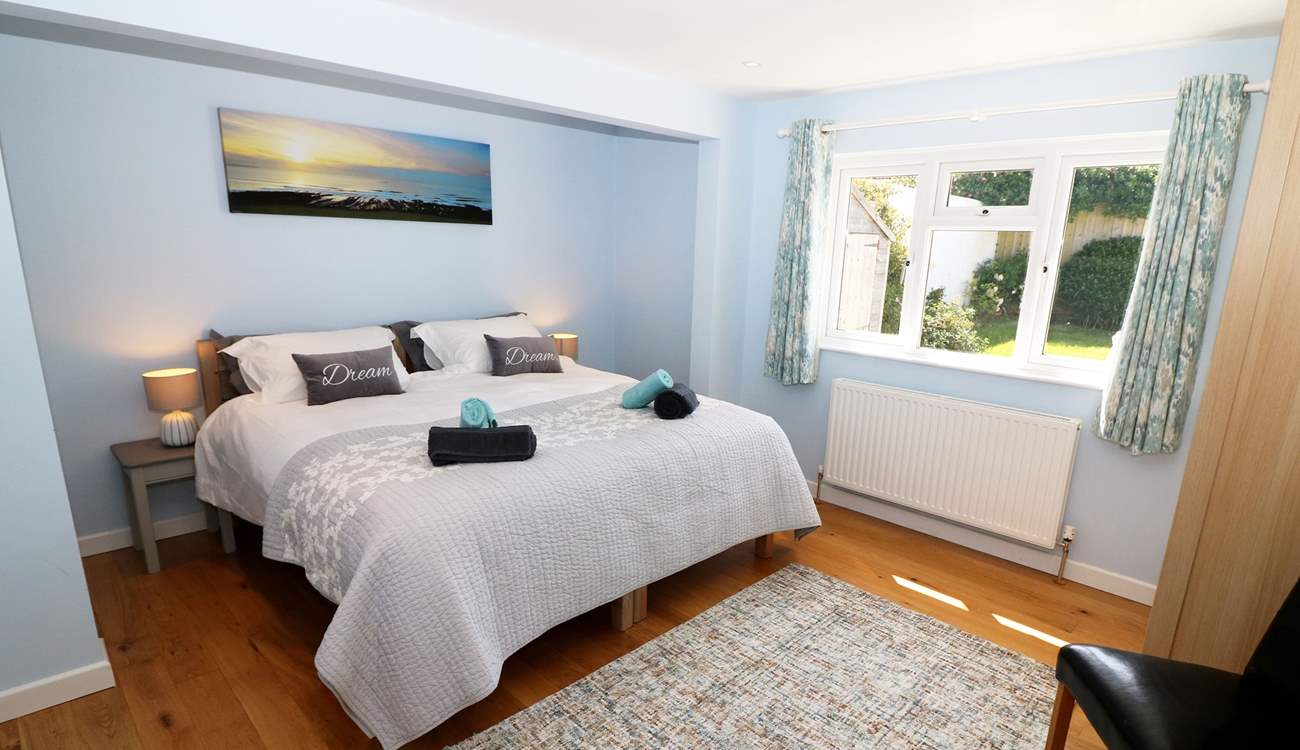 The bedrooms are decorated in cool, seaside colours. 