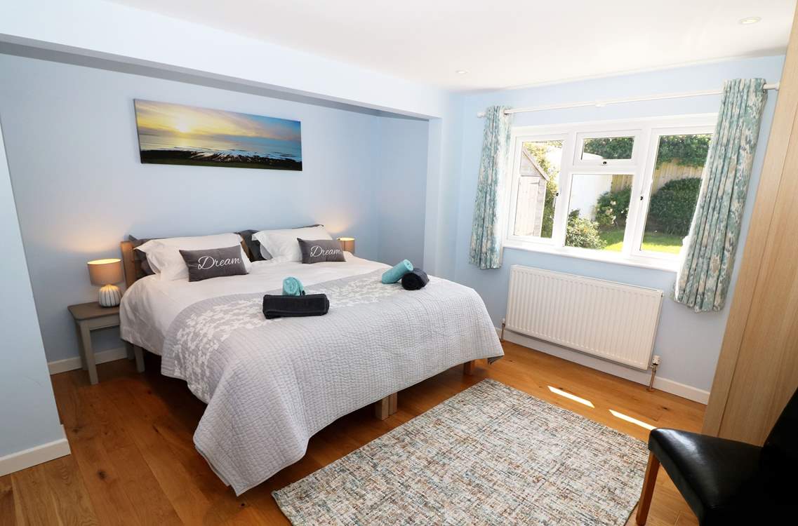 The bedrooms are decorated in cool, seaside colours.