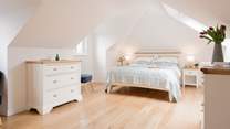 This gorgeous bedroom sits on the first floor with an en suite bedroom.