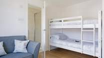The spacious bunk bedroom offers an en suite shower-room. 