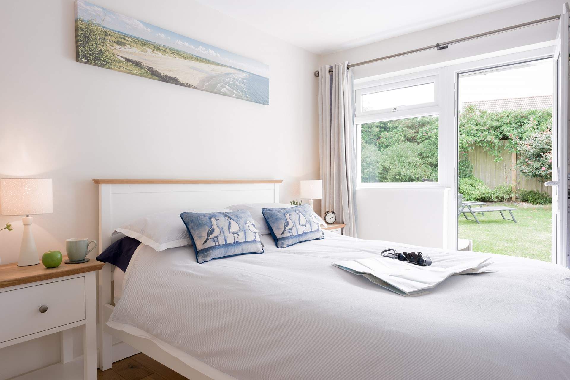 Bedroom 2 offers the perfect spot to relax and recharge with a door out to the back garden.