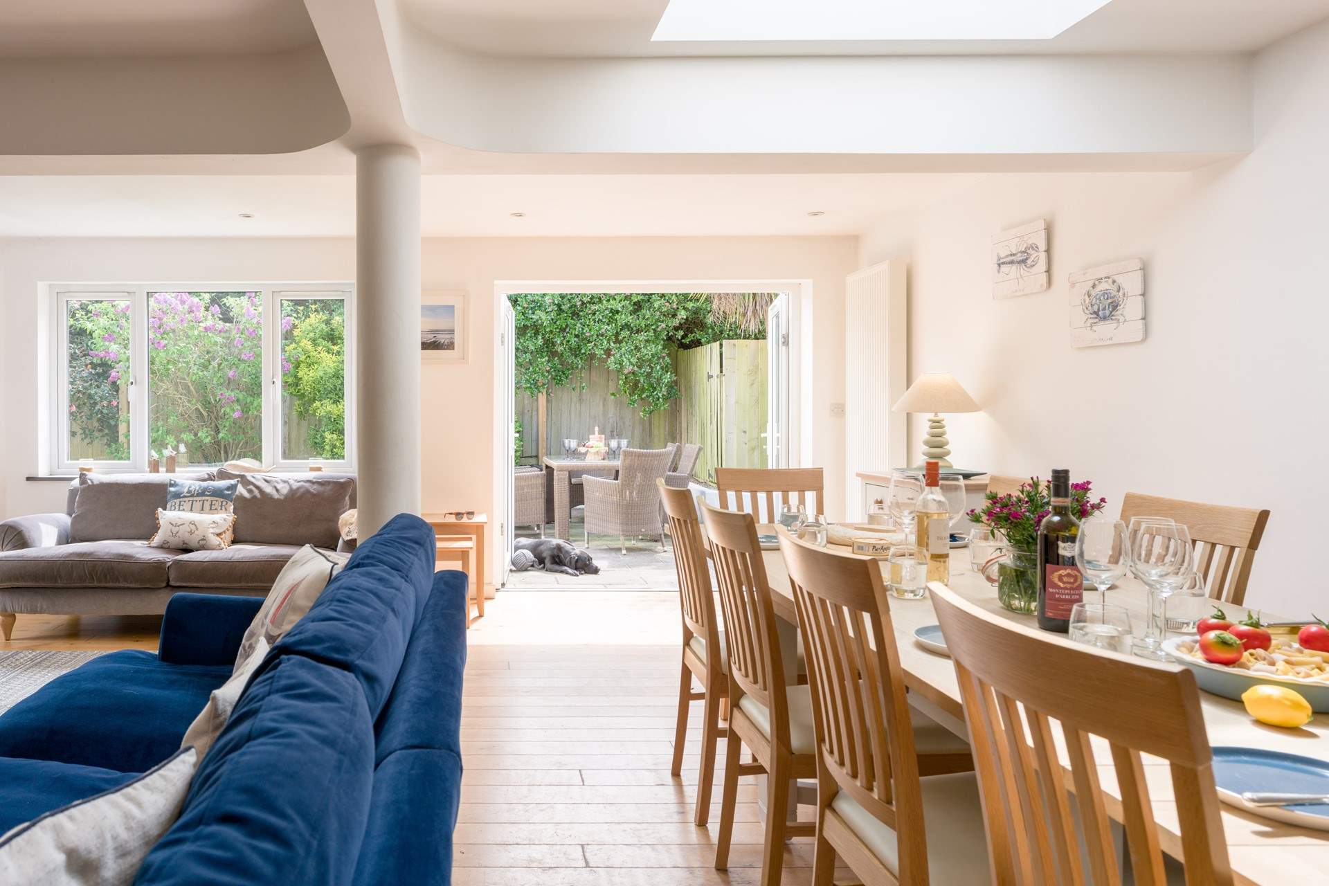 The room floods with light and opens up on to the back garden with hot tub.
