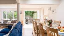 The room floods with light and opens up on to the back garden with hot tub.