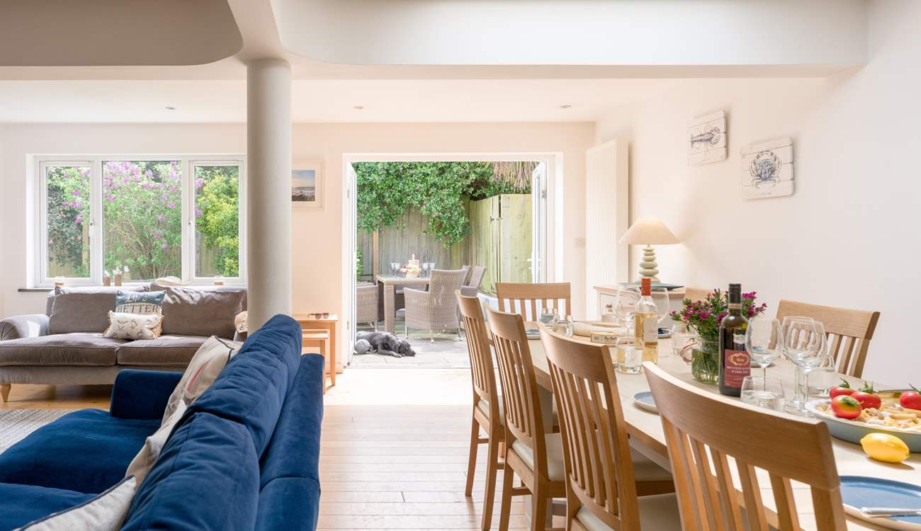 The room floods with light and opens up on to the back garden with hot tub.