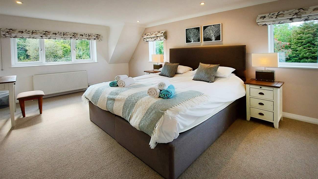 The main bedroom has a super-king double bed.
