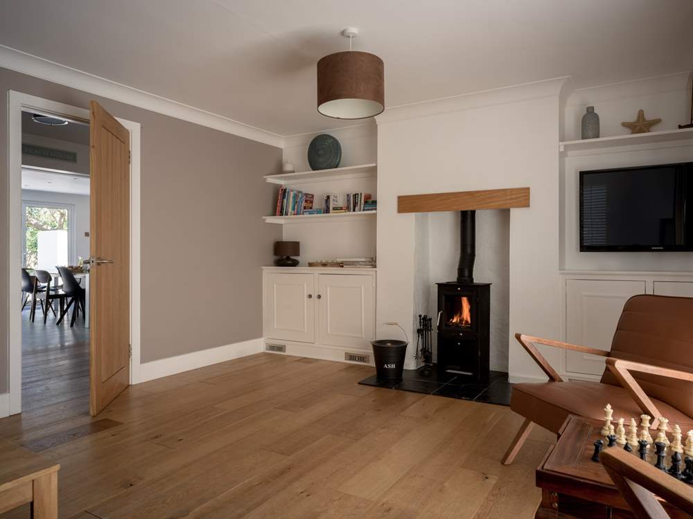 The sitting-room has a warming wood-burner, perfect for cosy nights in.