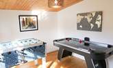 The games-room is at the bottom of the garden with an air hockey table, table football and retro arcade games machine. - Thumbnail Image