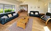 After a busy beach day, catch up with a drink and a movie on the Smart TV. - Thumbnail Image