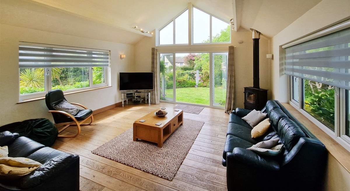 The delightful sitting-room has a warming wood-burner to keep you cosy throughout the seasons. 