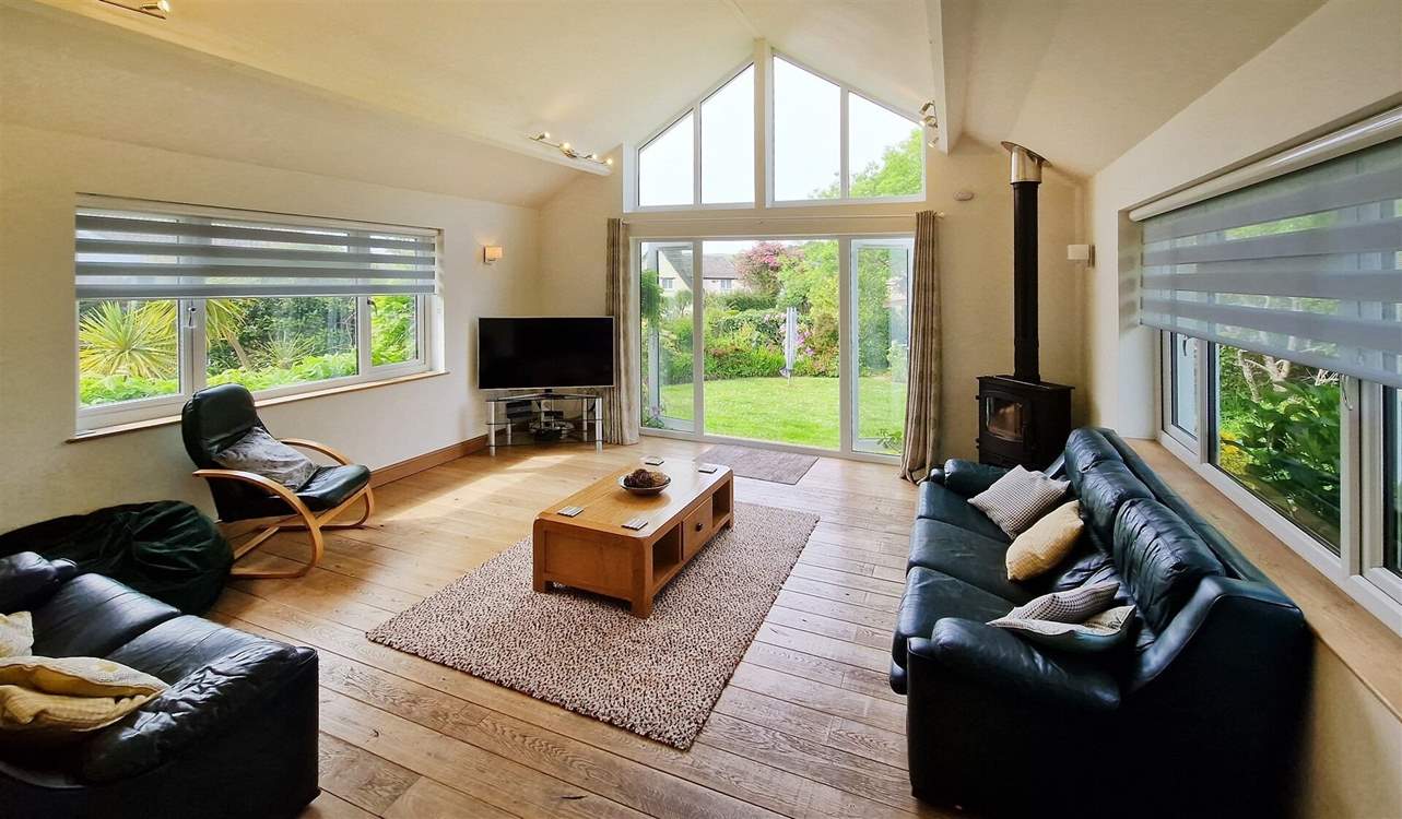 The delightful sitting-room has a warming wood-burner to keep you cosy throughout the seasons.