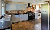 The kitchen is stylish and well-equipped. - Thumbnail Image