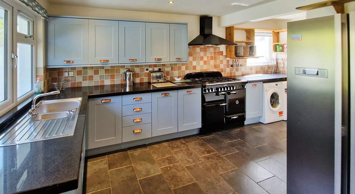 The kitchen is stylish and well-equipped.