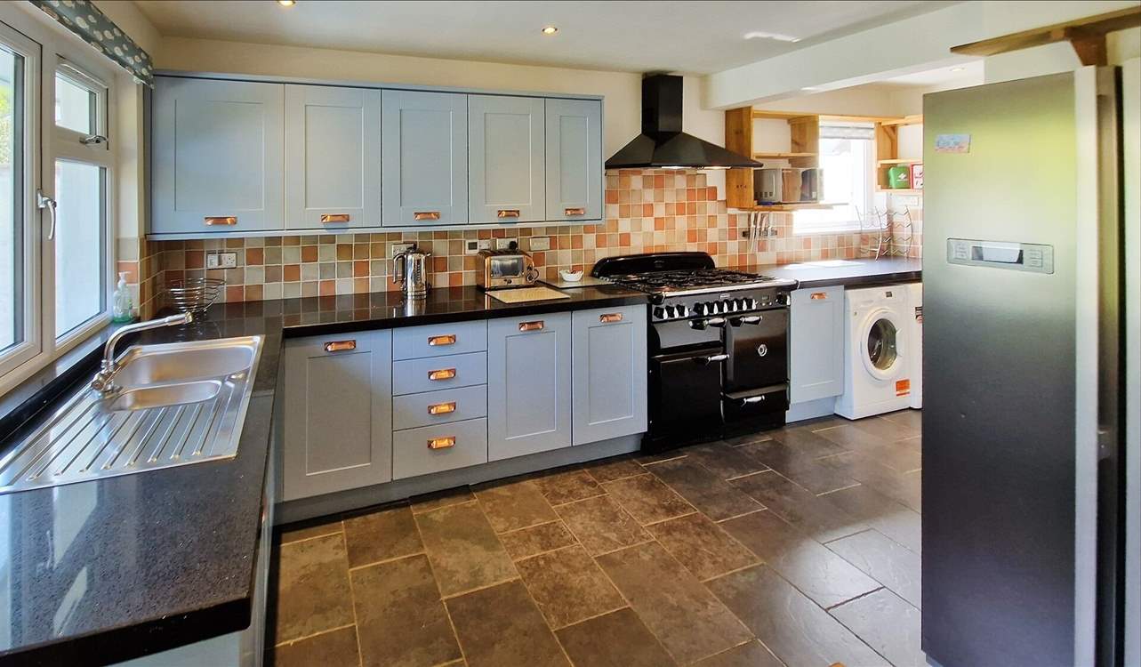 The kitchen is stylish and well-equipped.