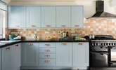 The kitchen is stylish and well-equipped. - Thumbnail Image