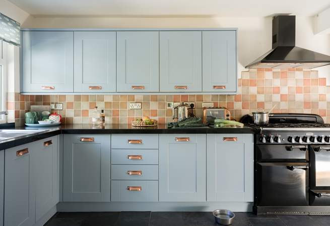 The kitchen is stylish and well-equipped.