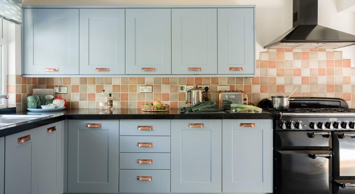 The kitchen is stylish and well-equipped.