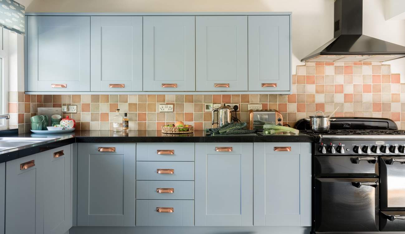 The kitchen is stylish and well-equipped.