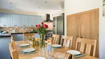 Gather everyone around the table in the kitchen/diner to enjoy a holiday meal. 