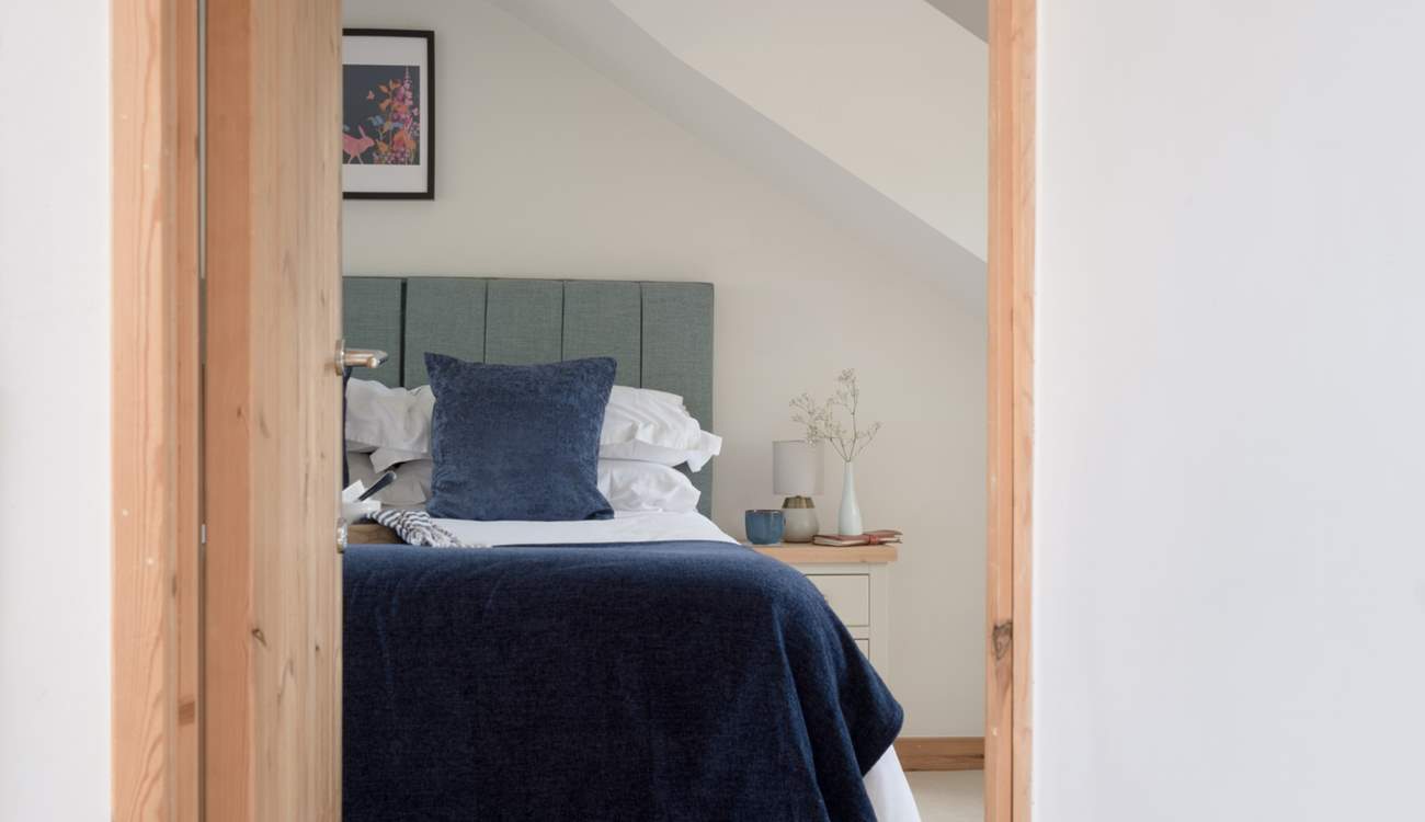 Head across the landing to find yet another spacious bedroom.