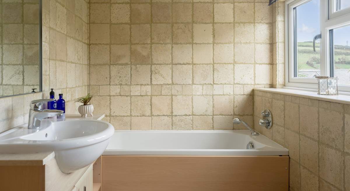 The bathroom has a separate shower and bath. 