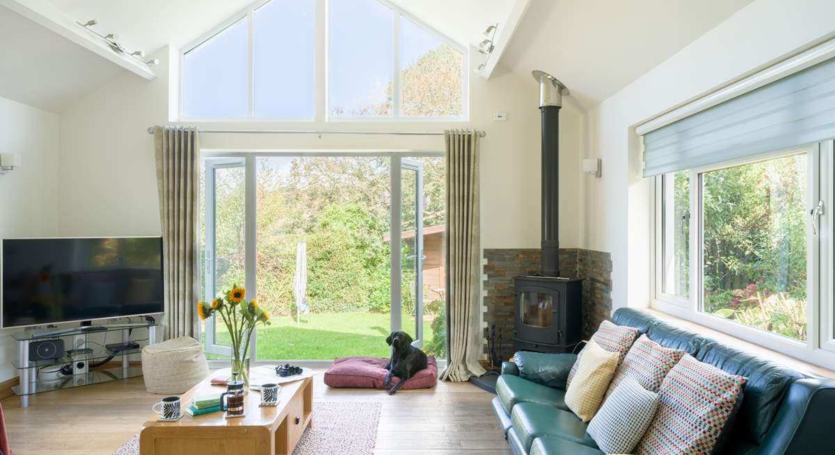 Welcome to Hideway, the delightful sitting-room has a warming wood-burner to keep you cosy throughout the seasons. 