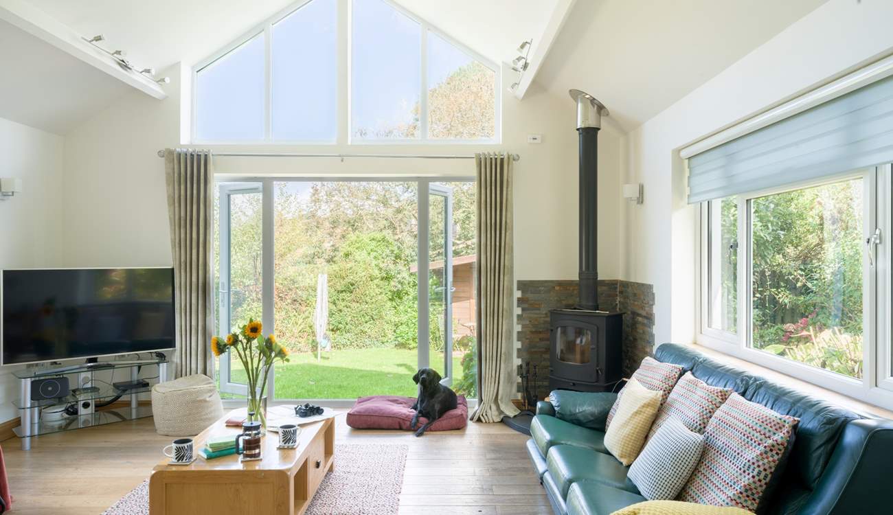 Welcome to Hideway, the delightful sitting-room has a warming wood-burner to keep you cosy throughout the seasons. 