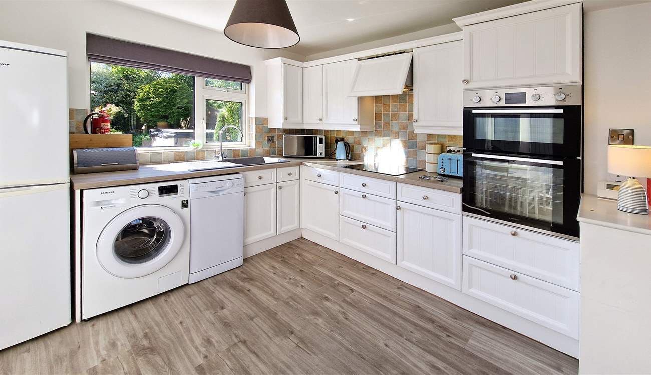 The kitchen looks out over the garden.