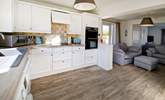 The open plan living area, with a light and airy kitchen. - Thumbnail Image