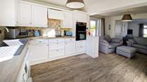 The open plan living area, with a light and airy kitchen.