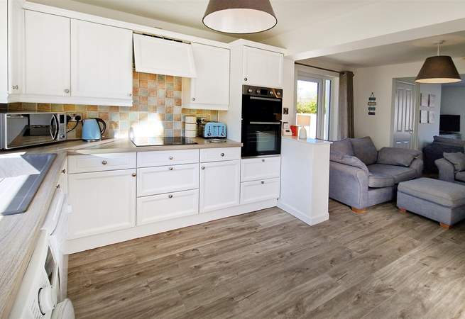 The open plan living area, with a light and airy kitchen.