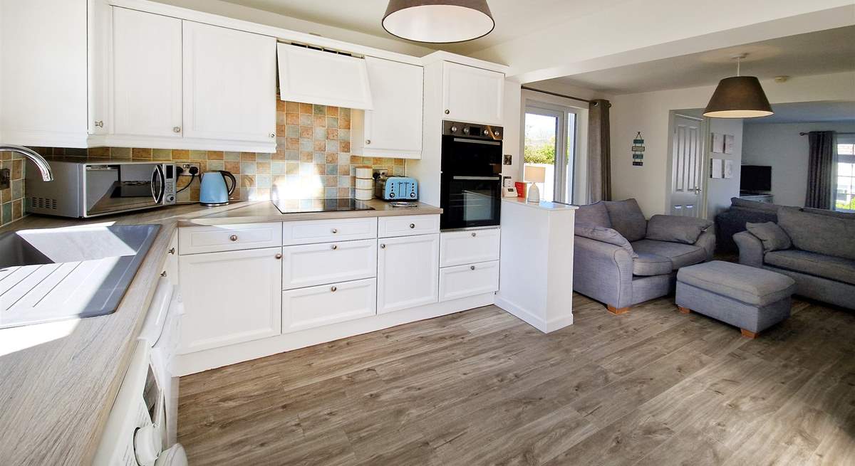 The open plan living area, with a light and airy kitchen.