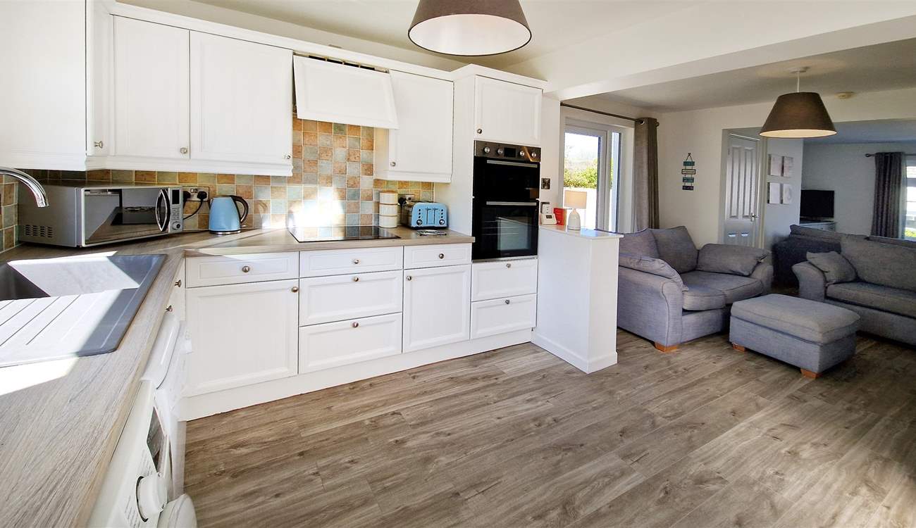 The open plan living area, with a light and airy kitchen.