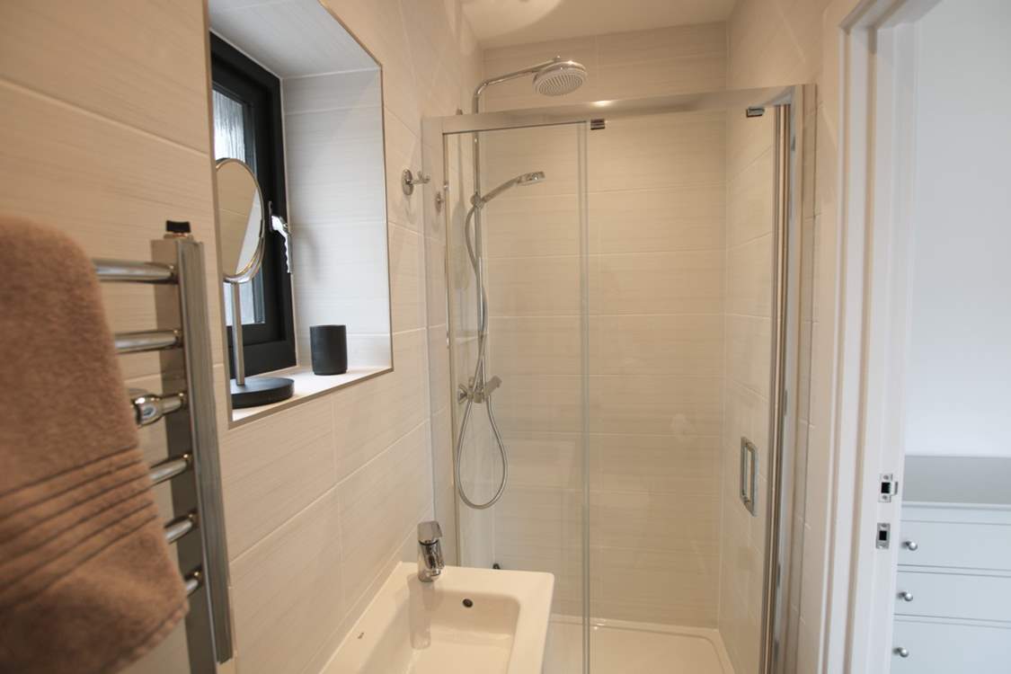 Bedroom 1 has an en suite shower-room.