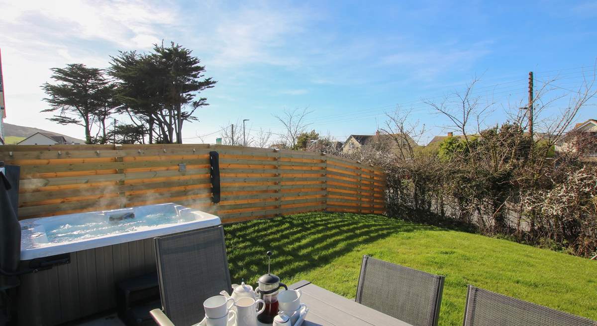 Relax in the hot tub after a busy day on the beach - additional charges apply.