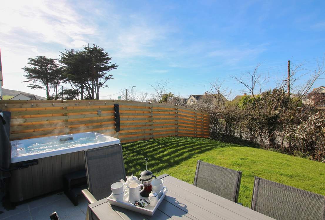 Relax in the hot tub after a busy day on the beach - additional charges apply.