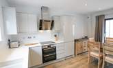 The sleek modern kitchen.  - Thumbnail Image