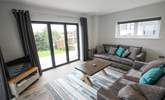 After a busy day, cuddle up on the sofa and catch a movie on the Smart TV. - Thumbnail Image