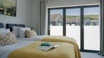 You will find two double bedrooms with 'zip and link' beds on the first floor, and a bunk room. 