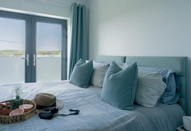 Bedroom 2 is a 'zip and link' and can be made up as a super-king or twin beds with a Juliet balcony facing towards the sea and an en suite shower-room.