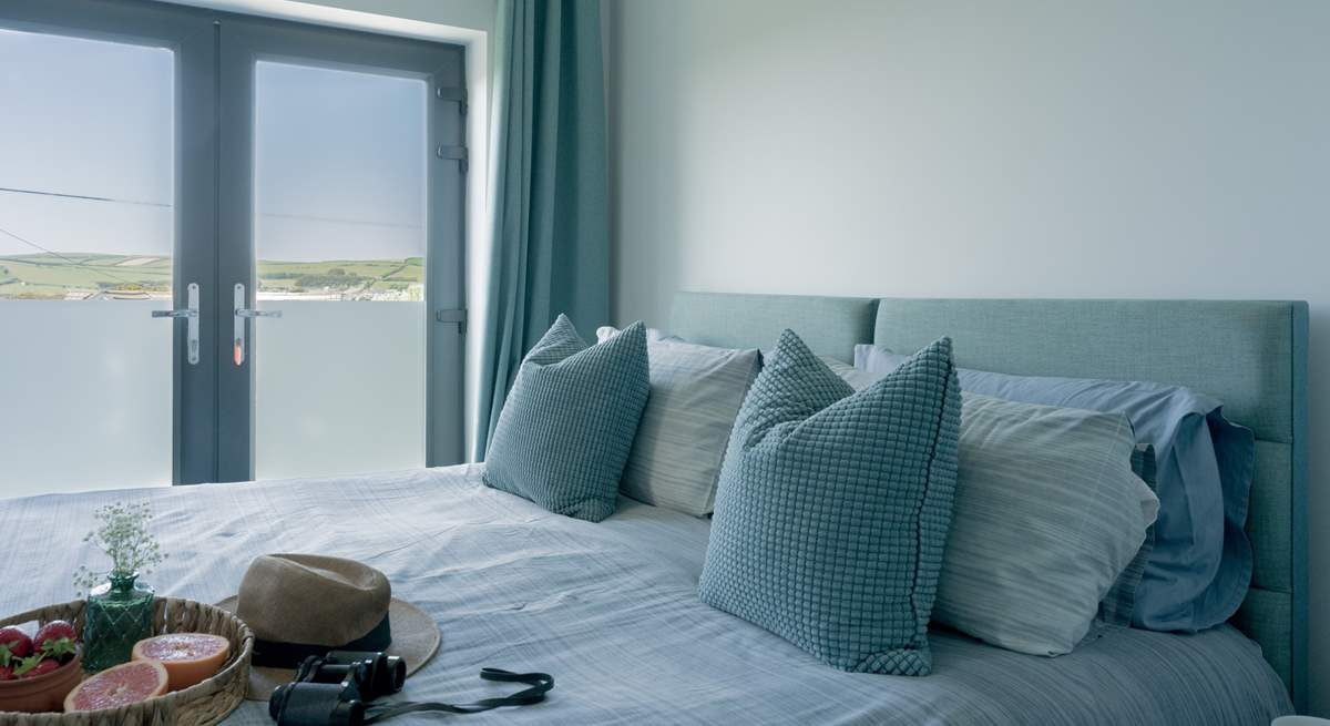Bedroom 2 is a 'zip and link' and can be made up as a super-king or twin beds with a Juliet balcony facing towards the sea and an en suite shower-room.