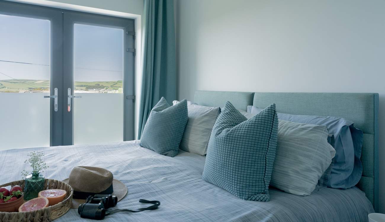 Bedroom 2 is a 'zip and link' and can be made up as a super-king or twin beds with a Juliet balcony facing towards the sea and an en suite shower-room.
