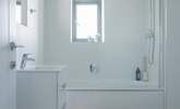 The family bathroom has a bath with shower over.  - Thumbnail Image