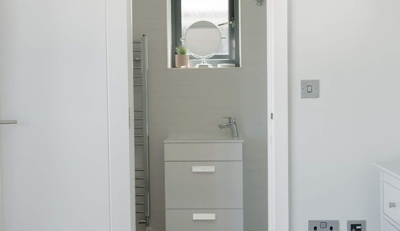 Bedroom 1 has an en suite shower-room.