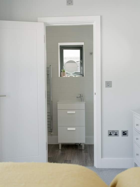 Bedroom 1 has an en suite shower-room.