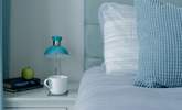 The beds are adorned with lovely linens. - Thumbnail Image