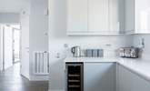 The sleek kitchen has everything you will need, including that all-important wine fridge! - Thumbnail Image