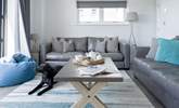 After a busy day, cuddle up on the sofa and catch a movie on the Smart TV. - Thumbnail Image